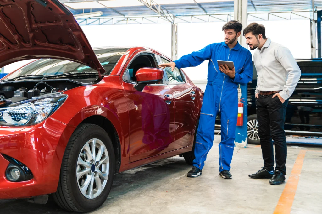 mechanic-man-shows-car-report-digital-tablet-middle-east-customer-garage by masteemechanics